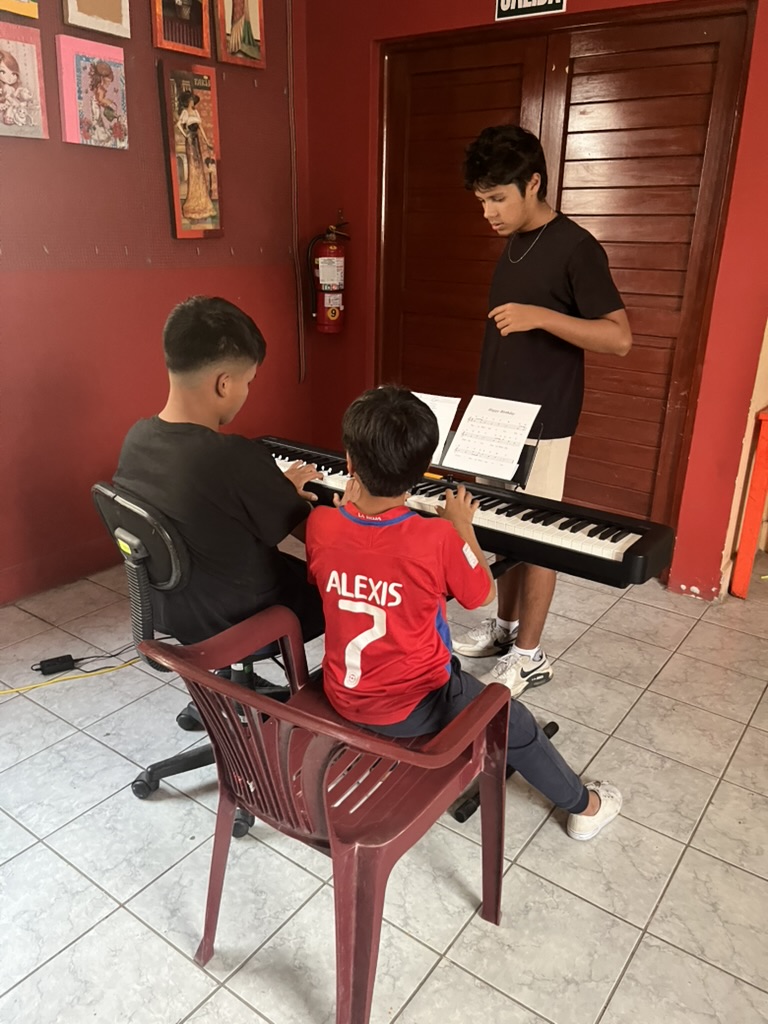 Children in Peru learning music together